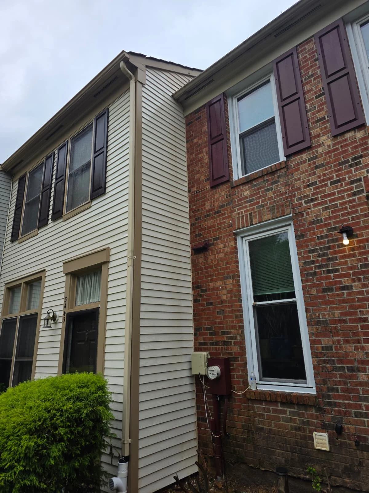 A full view of the property’s siding and brick façade.
