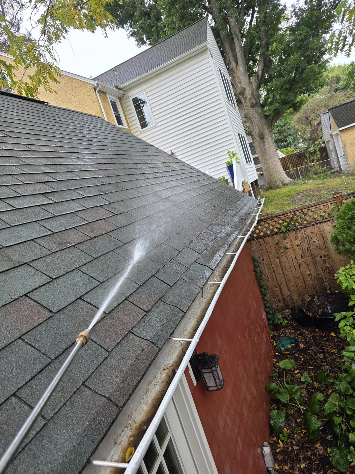 On-site roof and gutter cleaning in progress.